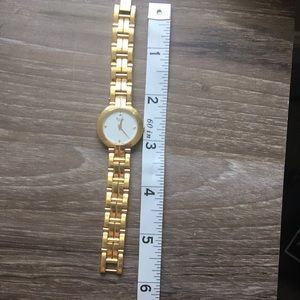 Bulova quartz gold watch.